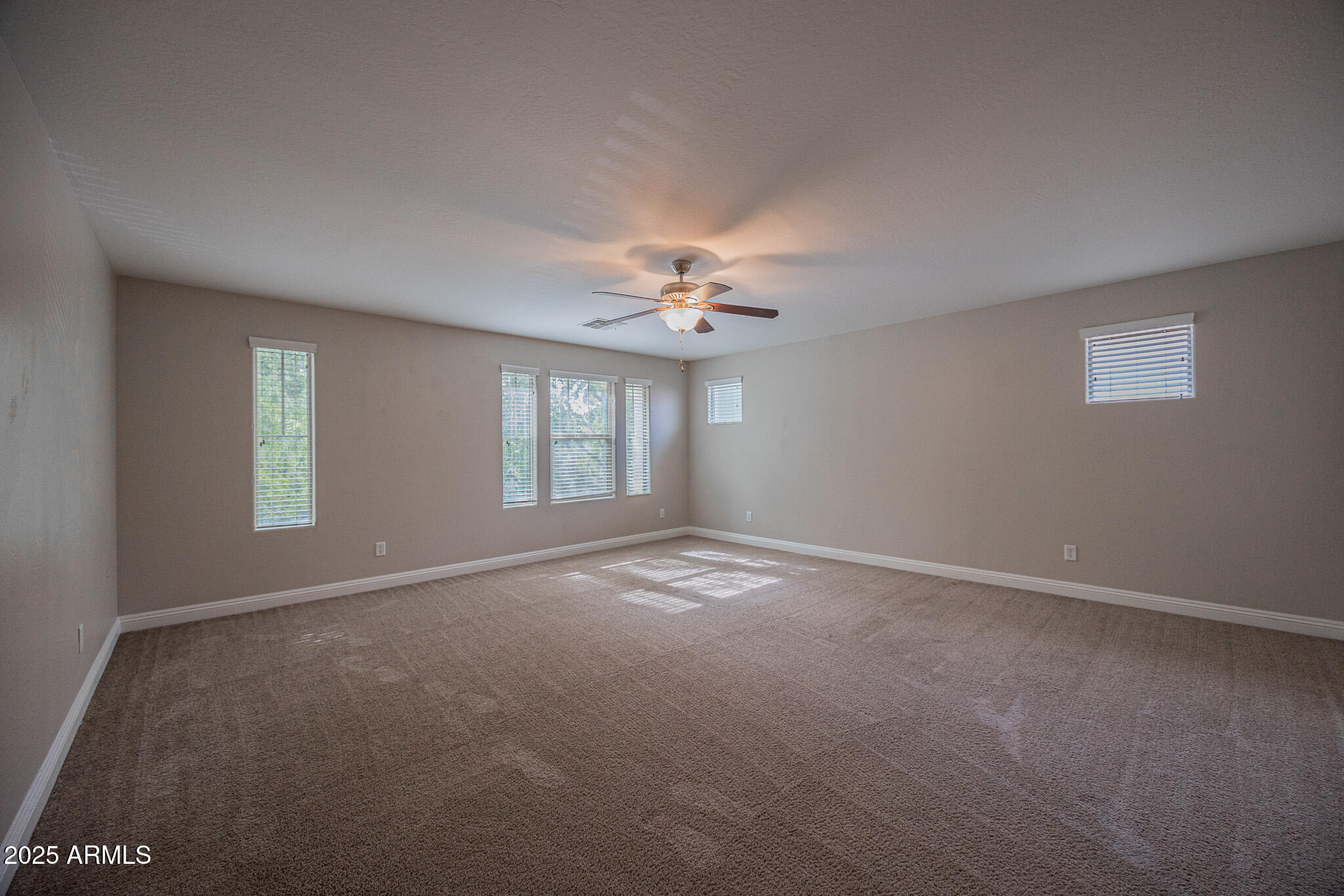 3314 East Sheffield Road Gilbert, AZ 85296 - Photo 12 of 31 a view of an empty room with a window