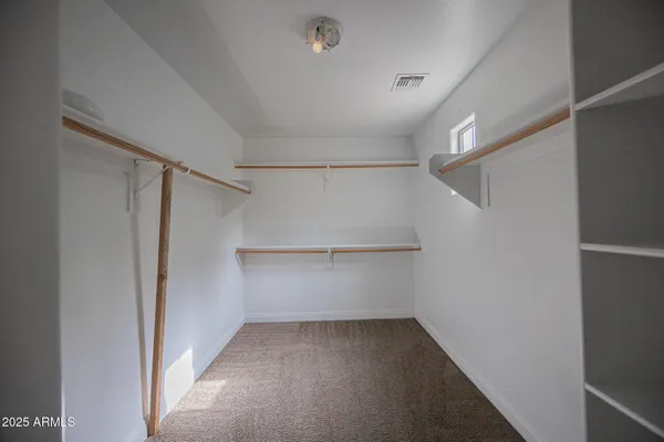 a view of an empty walk in closet