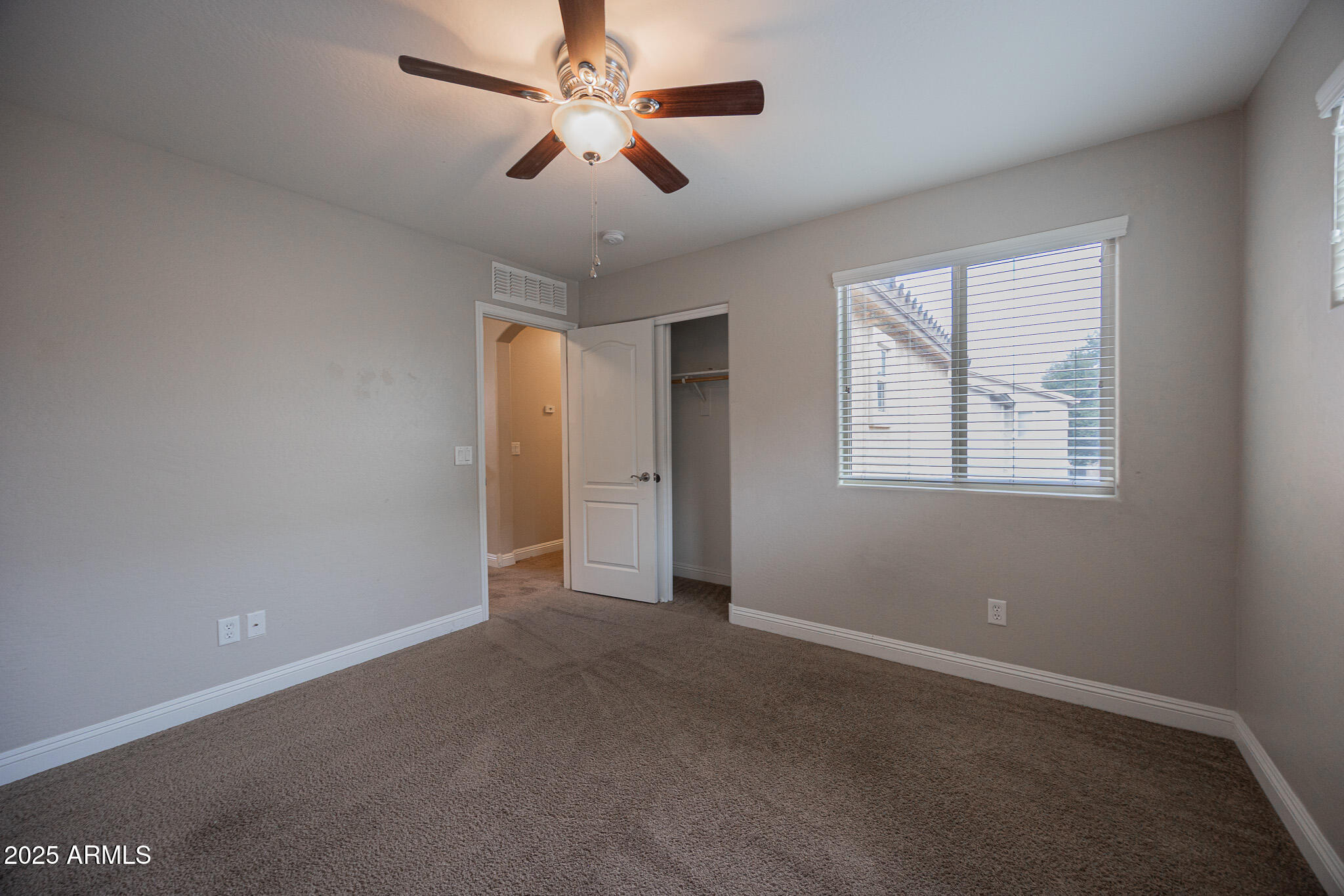 3314 East Sheffield Road Gilbert, AZ 85296 - Photo 19 of 31 a view of an empty room with a window