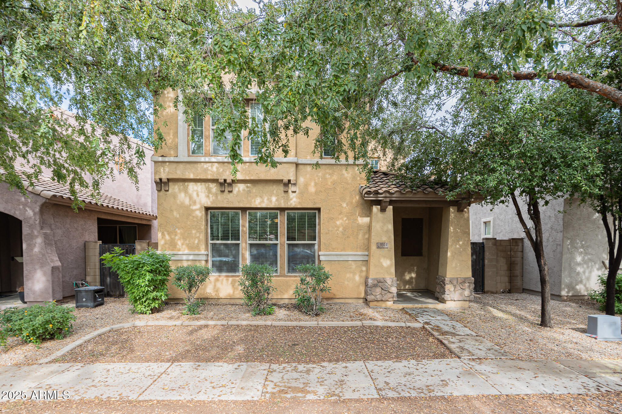 3314 East Sheffield Road Gilbert, AZ 85296 - Photo 2 of 31 a front view of a house with garden