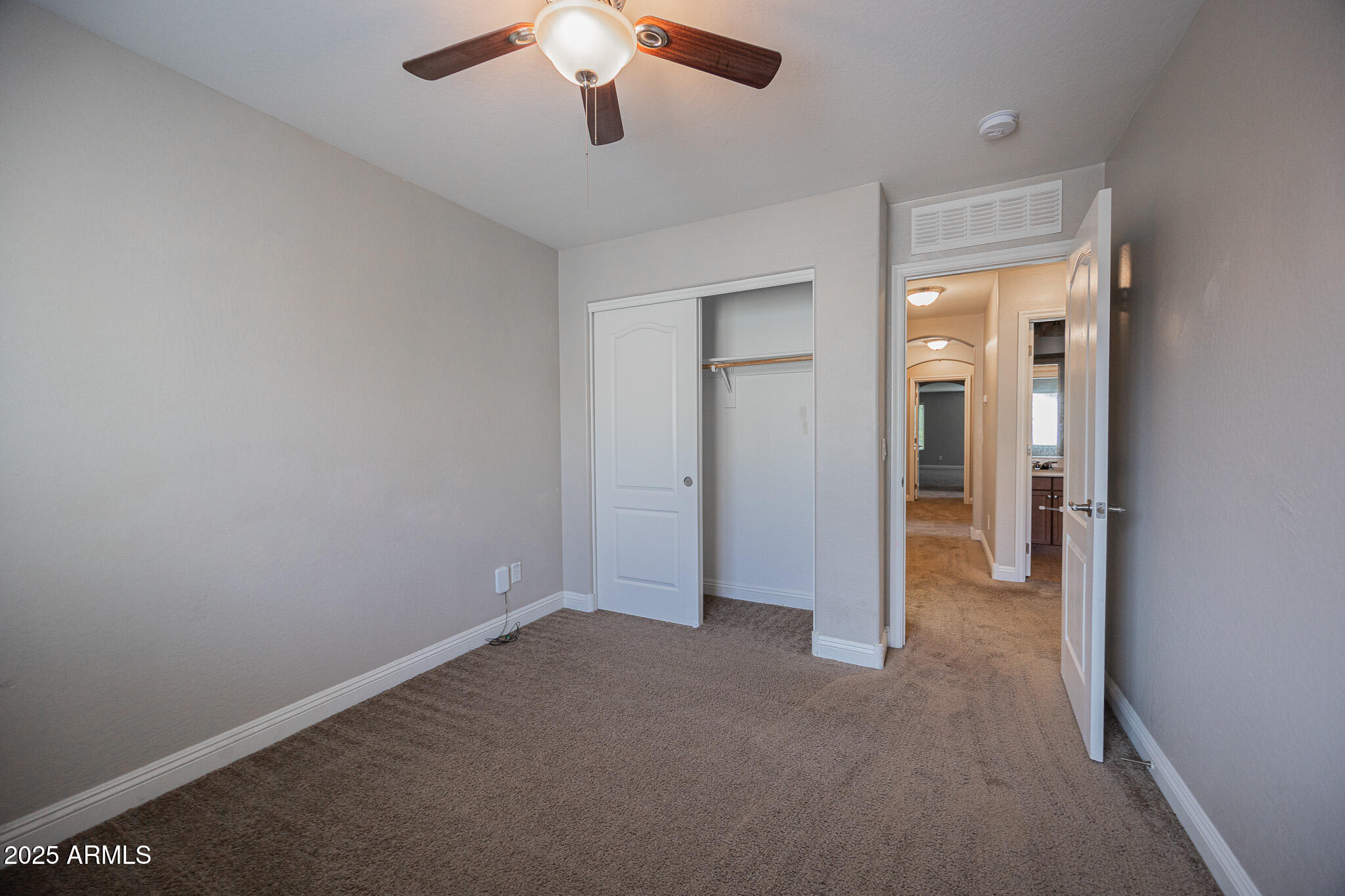 3314 East Sheffield Road Gilbert, AZ 85296 - Photo 24 of 31 an empty room with a empty space and a ceiling fan