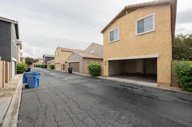 a view of a house with a yard and garage