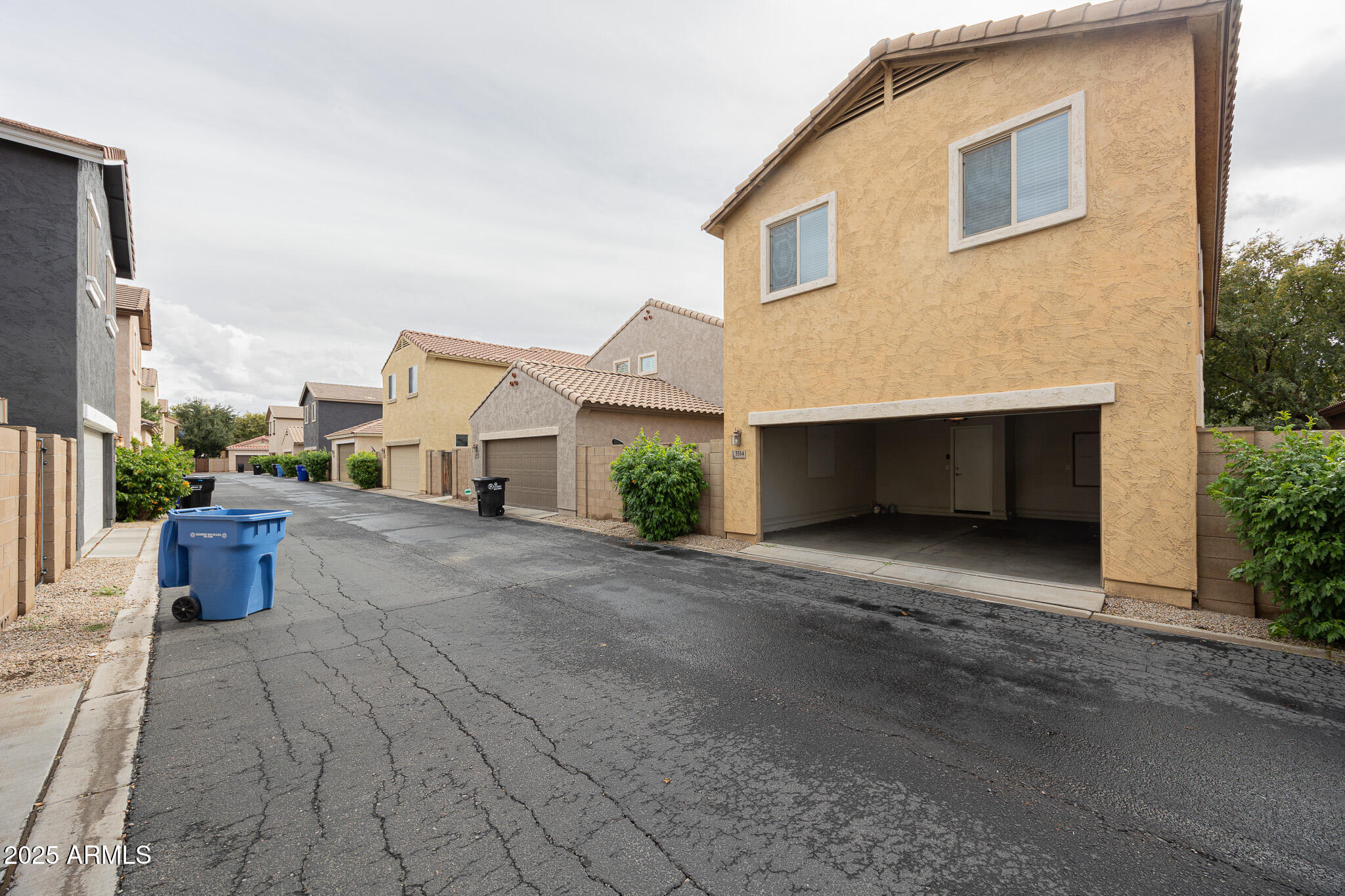 3314 East Sheffield Road Gilbert, AZ 85296 - Photo 28 of 31 a view of a house with a yard and garage