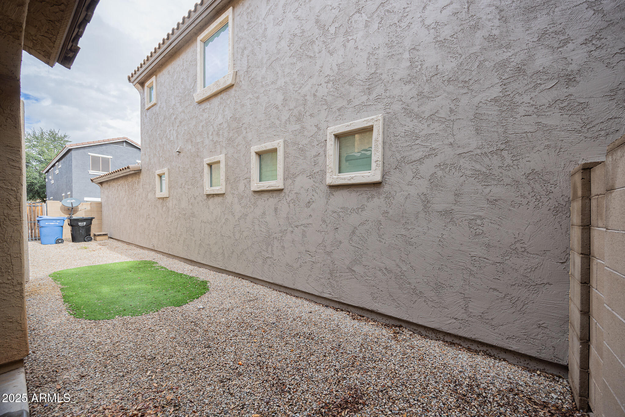 3314 East Sheffield Road Gilbert, AZ 85296 - Photo 29 of 31 a view of a backyard with potted plants
