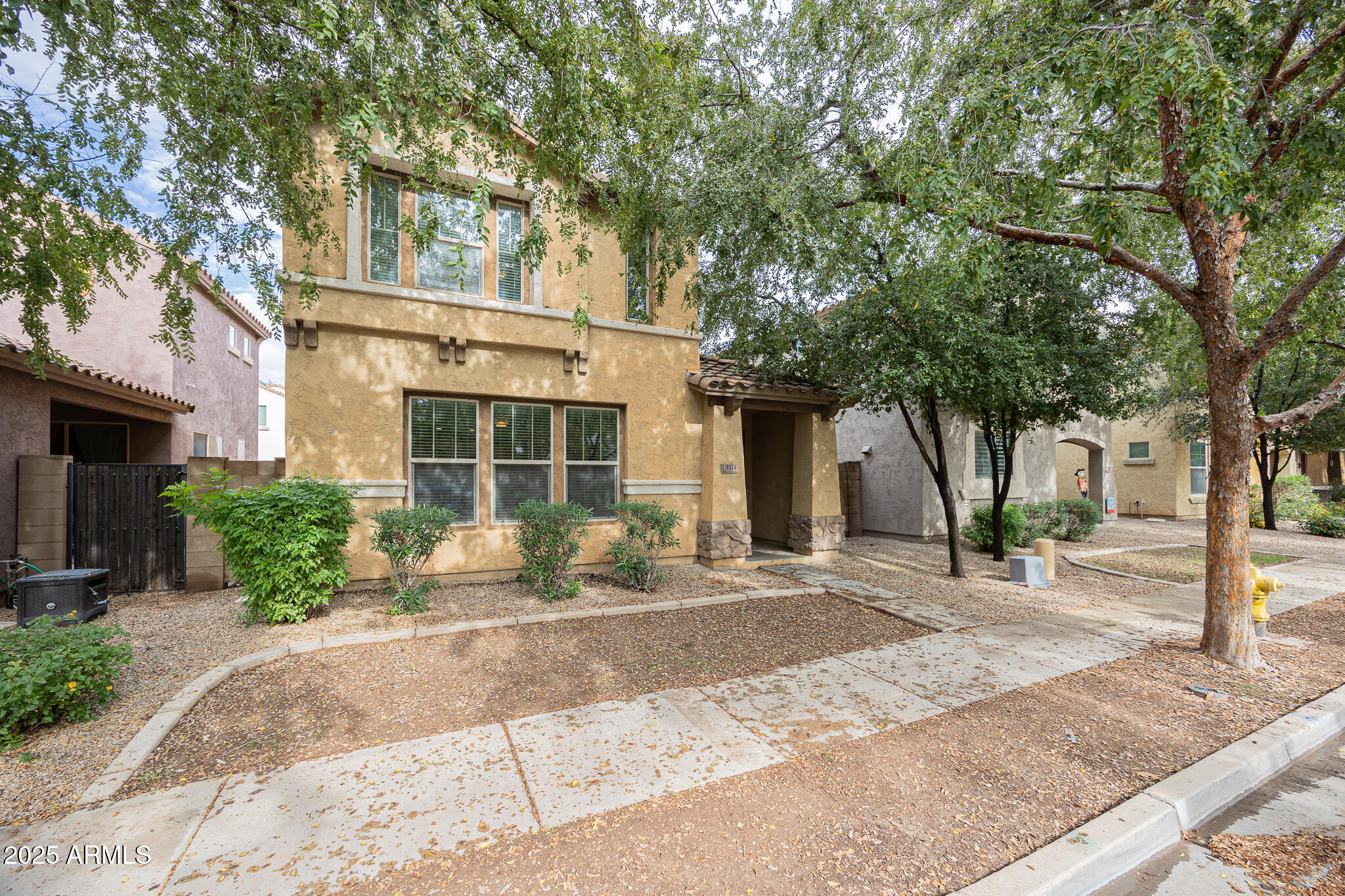 3314 East Sheffield Road Gilbert, AZ 85296 - Photo 3 of 31 a front view of a house with garden