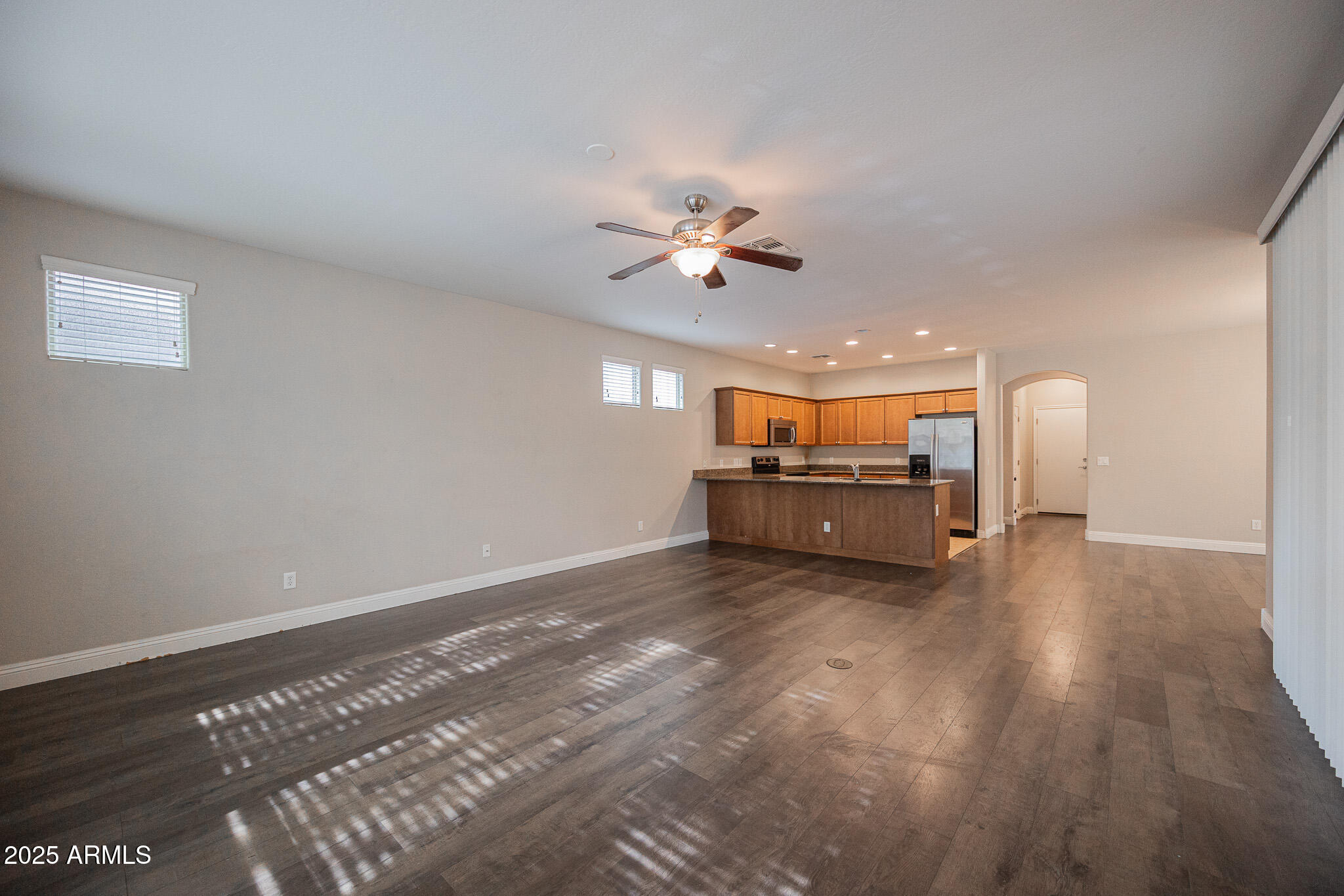 3314 East Sheffield Road Gilbert, AZ 85296 - Photo 5 of 31 a view of a livingroom with a flat screen tv