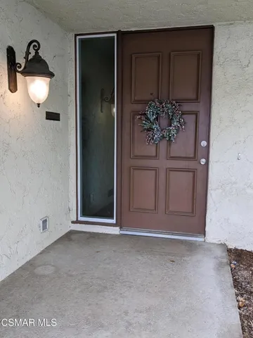 a view of a room with a potted plant