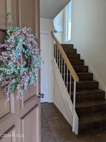 a view of entryway with flower pots