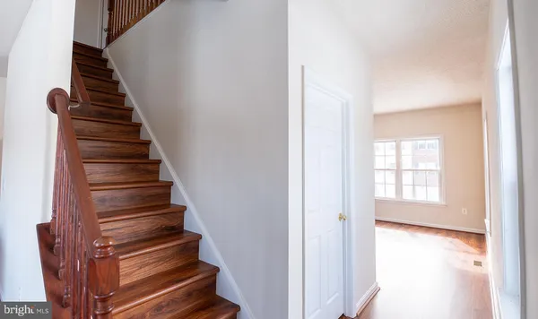 a view of entryway with wooden floor