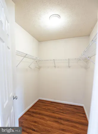 a view of a room with racks on the wall