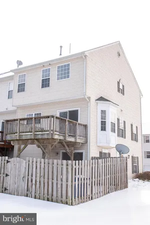 a front view of a house with a fence