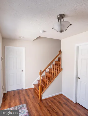 a view of an entryway with wooden floor