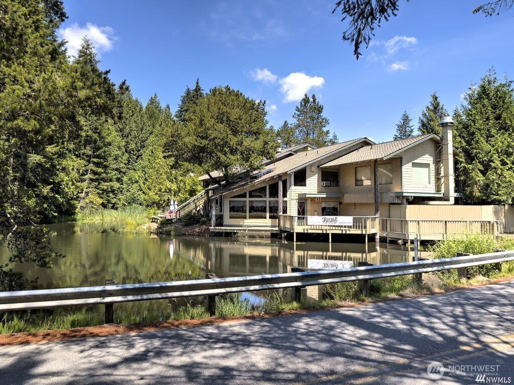 200 East Soderberg Road Allyn, WA 98524 - Photo 16 of 20 a front view of a house with a large window