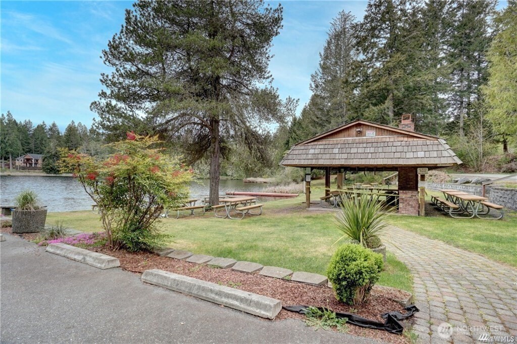 200 East Soderberg Road Allyn, WA 98524 - Photo 17 of 20 a front view of a house with garden