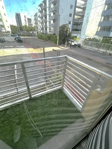 a view of a kitchen from the hallway