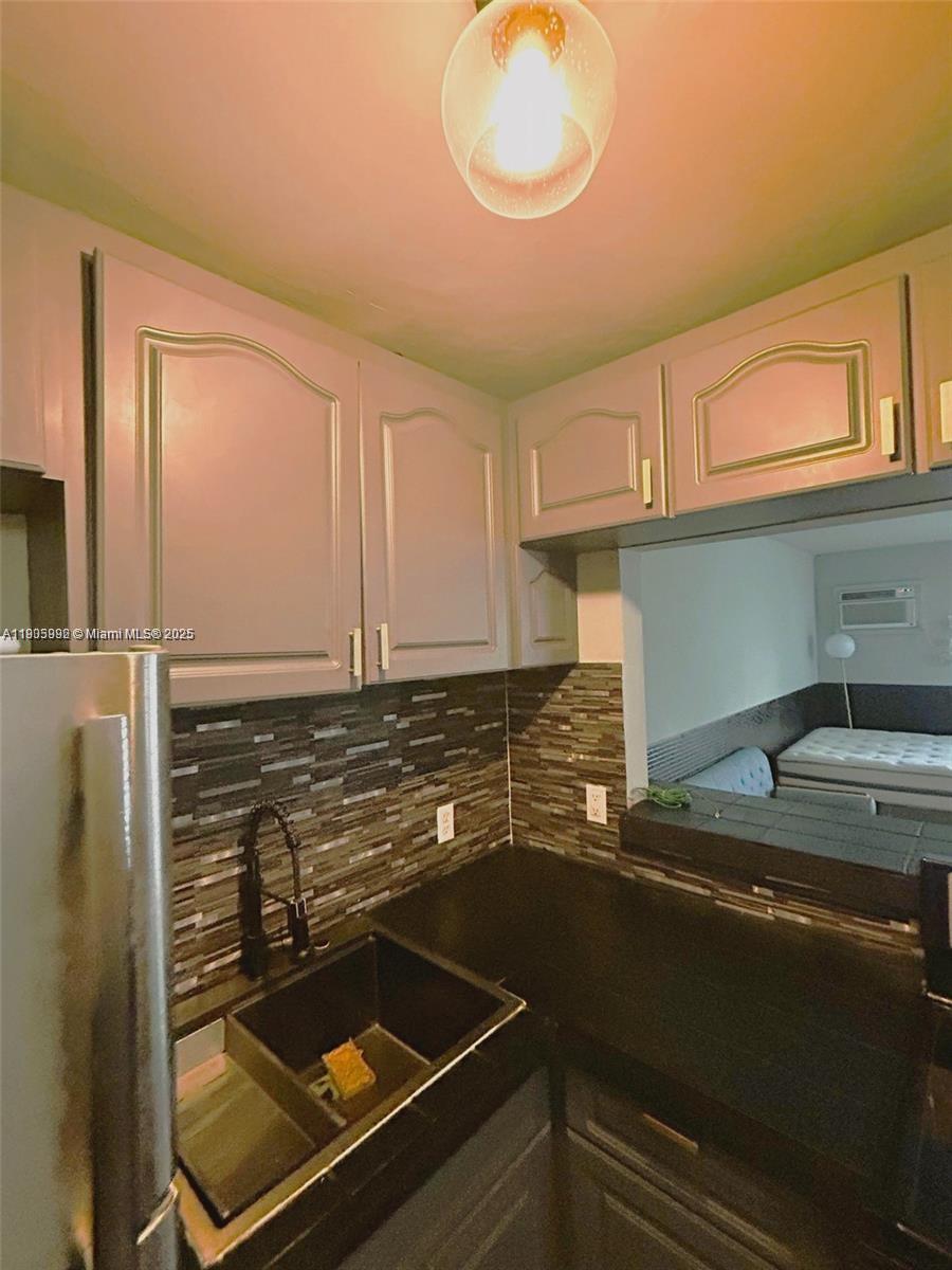 1441 Lincoln Road, Unit 217 Miami Beach, FL 33139 - Photo 15 of 15 a kitchen with a stove and a microwave