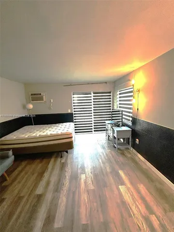 a view of a balcony with a yard