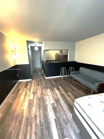 a view of kitchen and living room