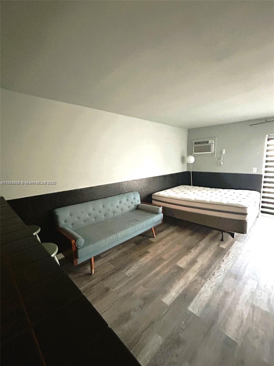 1441 Lincoln Road, Unit 217 Miami Beach, FL 33139 - Photo 6 of 15 a view of a room with wooden floor and white walls