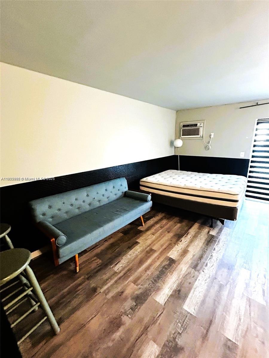 1441 Lincoln Road, Unit 217 Miami Beach, FL 33139 - Photo 10 of 15 a bedroom with two beds and a night stand