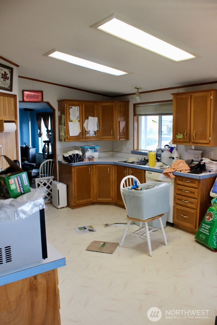 416 North Cedar Avenue Pasco, WA 99301 - Photo 16 of 20 a room with kitchen island granite countertop furniture and a large window