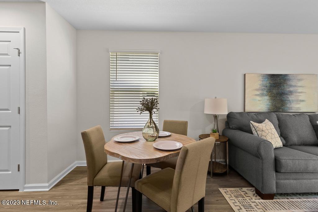 1330 Ellis Road South Jacksonville, FL 32205 - Photo 14 of 23 a view of a dining room with furniture and wooden floor