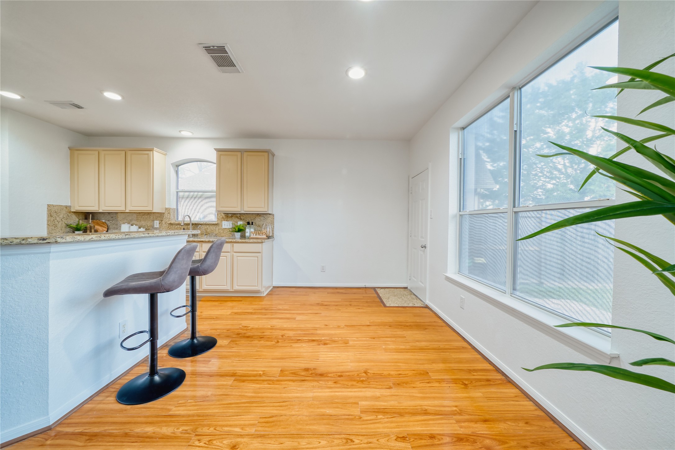 11115 Seminole Spring Lane Houston, TX 77089 - Photo 12 of 44 a kitchen with granite countertop a stove a sink and a refrigerator