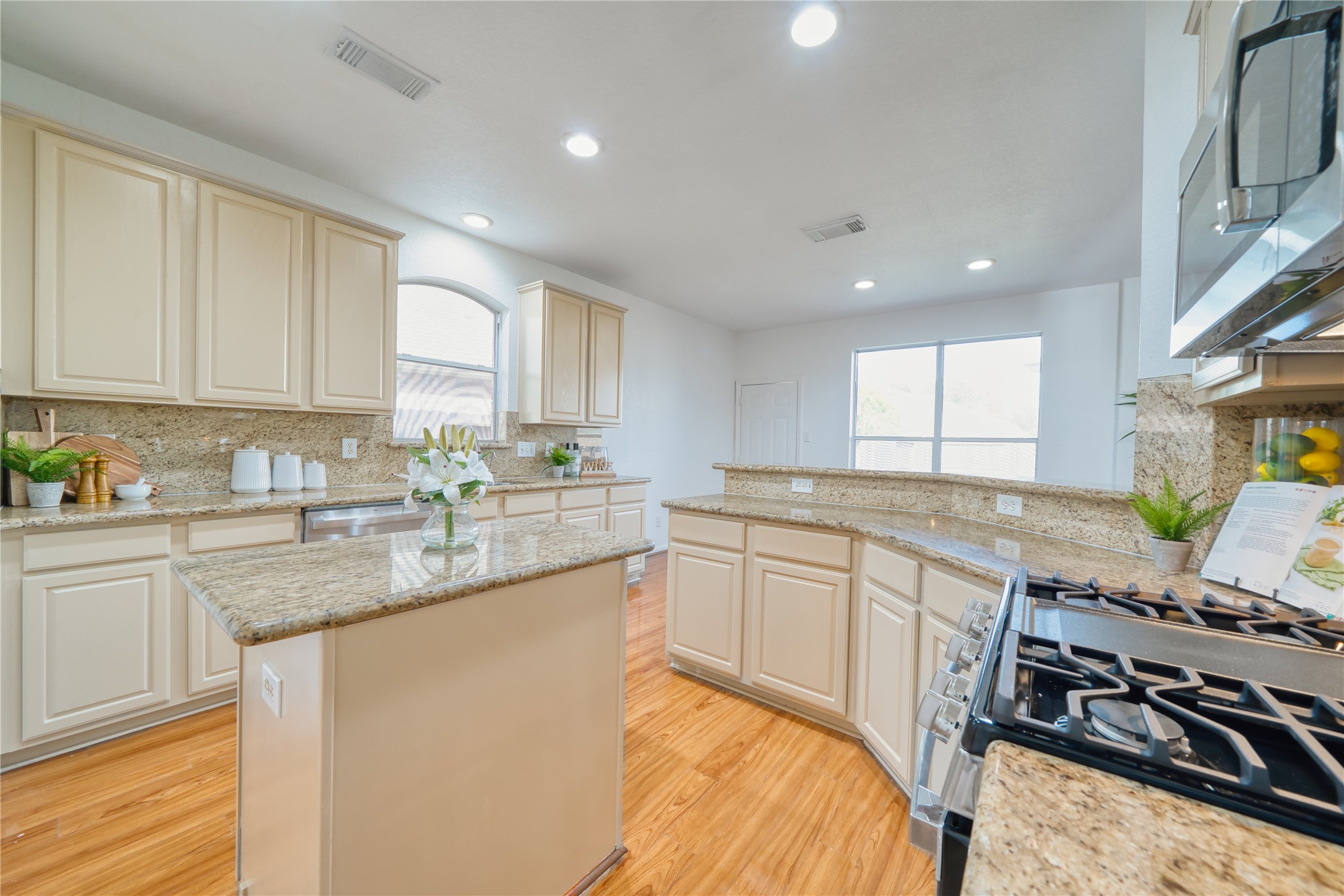 11115 Seminole Spring Lane Houston, TX 77089 - Photo 15 of 44 a kitchen with stainless steel appliances granite countertop a stove a sink and a white cabinets