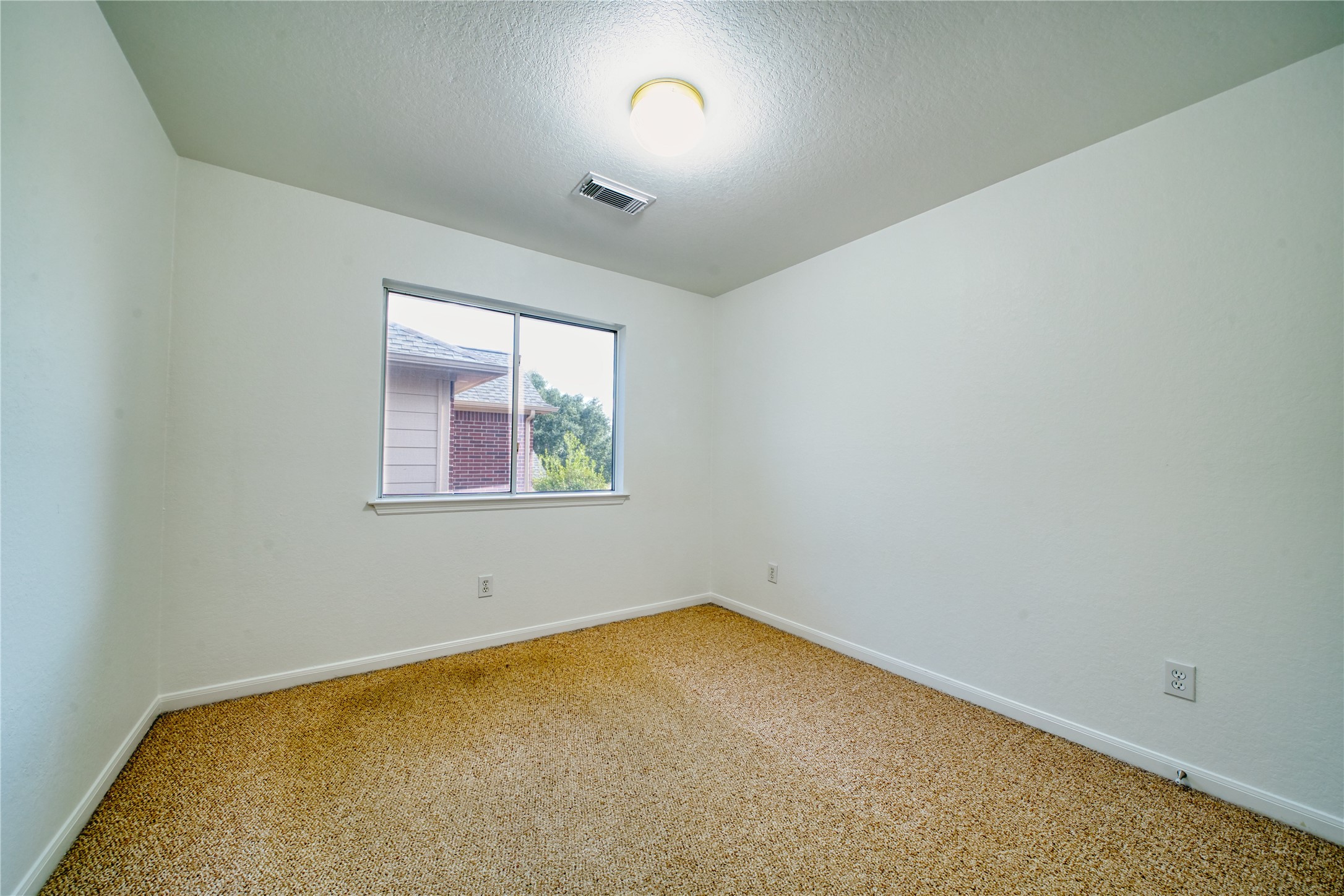 11115 Seminole Spring Lane Houston, TX 77089 - Photo 33 of 44 an empty room with a window