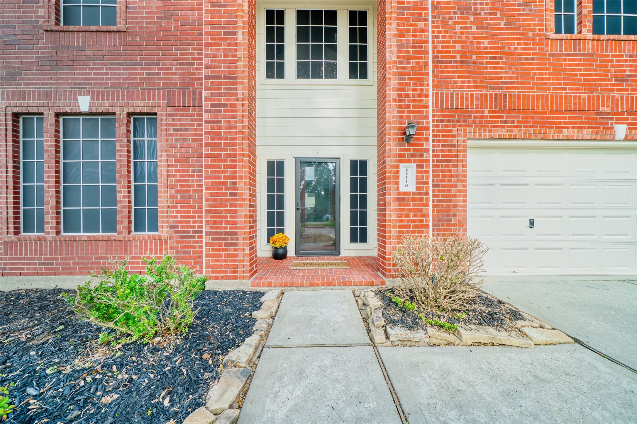 11115 Seminole Spring Lane Houston, TX 77089 - Photo 4 of 44 a view of brick building with large windows