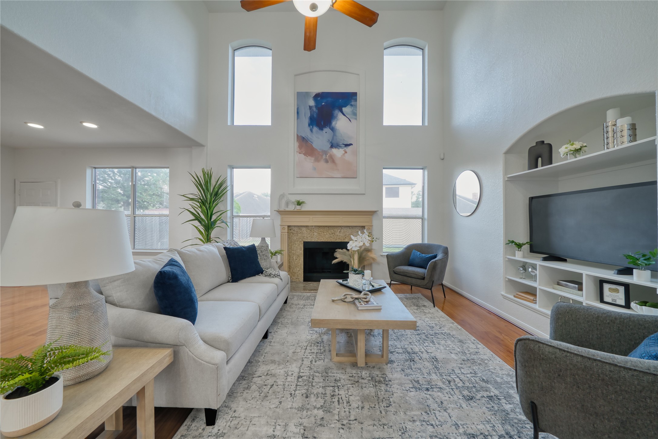 11115 Seminole Spring Lane Houston, TX 77089 - Photo 9 of 44 a living room with furniture a flat screen tv and a fireplace