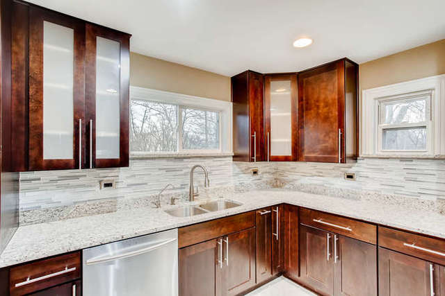26W421 Geneva Road Wheaton, IL 60187 - Photo 11 of 29 a kitchen with stainless steel appliances granite countertop a sink and a cabinets
