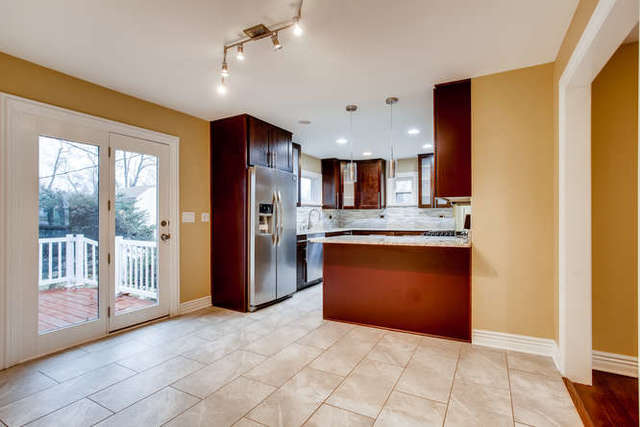 26W421 Geneva Road Wheaton, IL 60187 - Photo 14 of 29 a view of kitchen with granite countertop cabinets and refrigerator