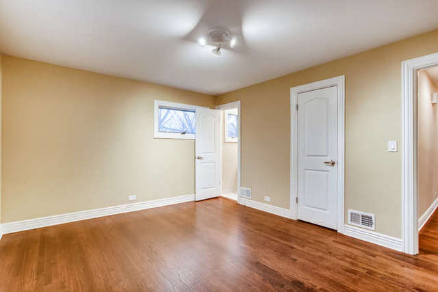 26W421 Geneva Road Wheaton, IL 60187 - Photo 16 of 29 a view of an empty room with wooden floor