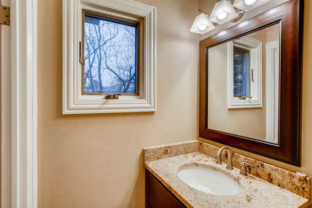 26W421 Geneva Road Wheaton, IL 60187 - Photo 17 of 29 a bathroom with a sink vanity and a mirror