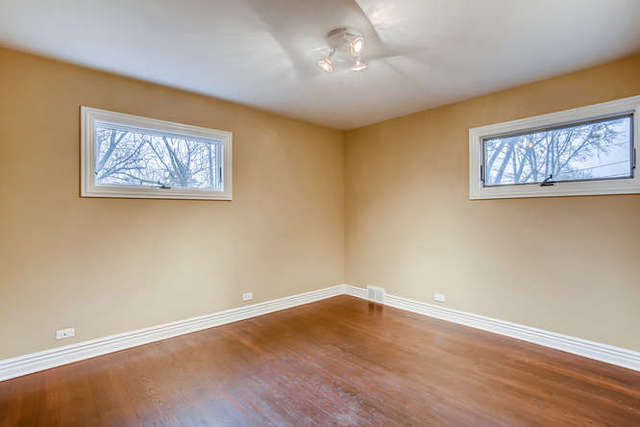 26W421 Geneva Road Wheaton, IL 60187 - Photo 21 of 29 a view of a room with wooden floor and window