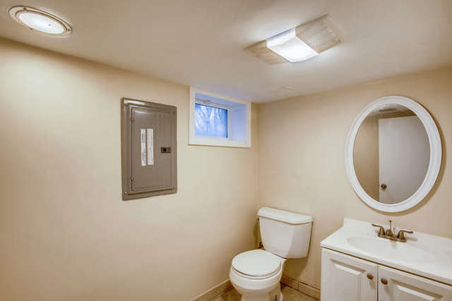 26W421 Geneva Road Wheaton, IL 60187 - Photo 24 of 29 a bathroom with a toilet a sink and mirror