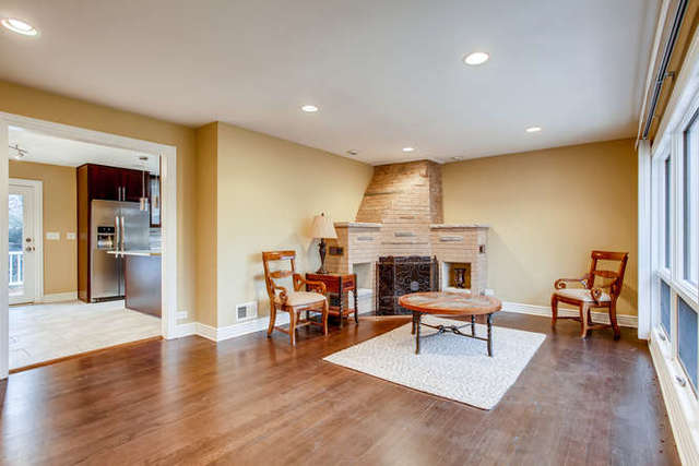 26W421 Geneva Road Wheaton, IL 60187 - Photo 7 of 29 a living room with furniture and a fireplace