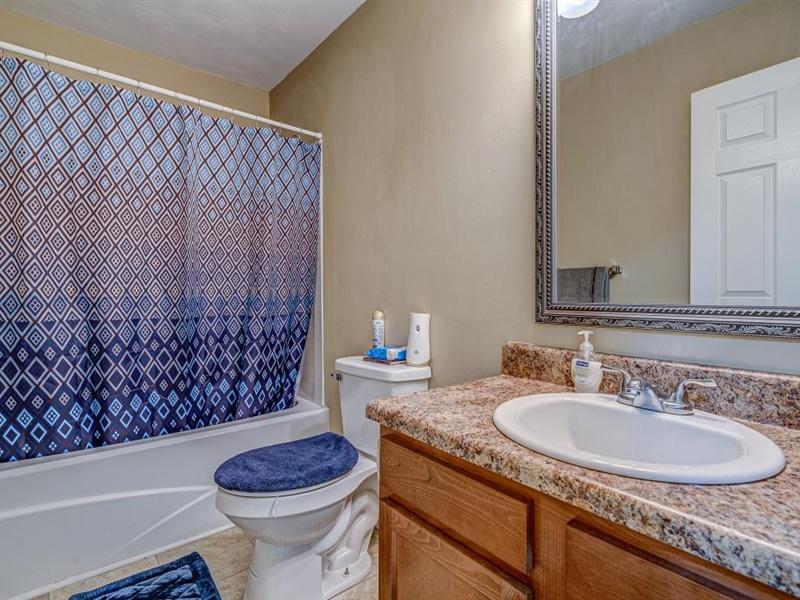 3460 Sterling Road Roanoke, VA 24014 - Photo 14 of 37 a bathroom with a granite countertop toilet sink and mirror