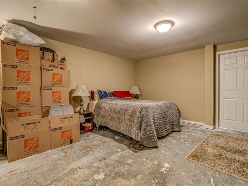 3460 Sterling Road Roanoke, VA 24014 - Photo 21 of 37 a bedroom with a bed and cabinets