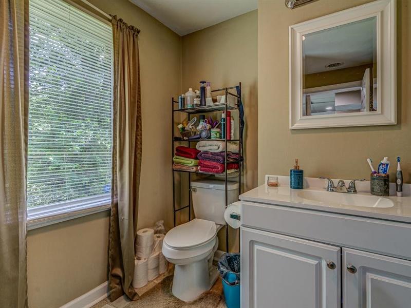3460 Sterling Road Roanoke, VA 24014 - Photo 31 of 37 a bathroom with a toilet sink and mirror