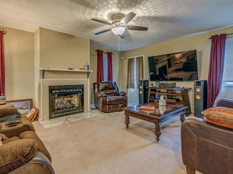 3460 Sterling Road Roanoke, VA 24014 - Photo 7 of 37 a living room with furniture and a fireplace