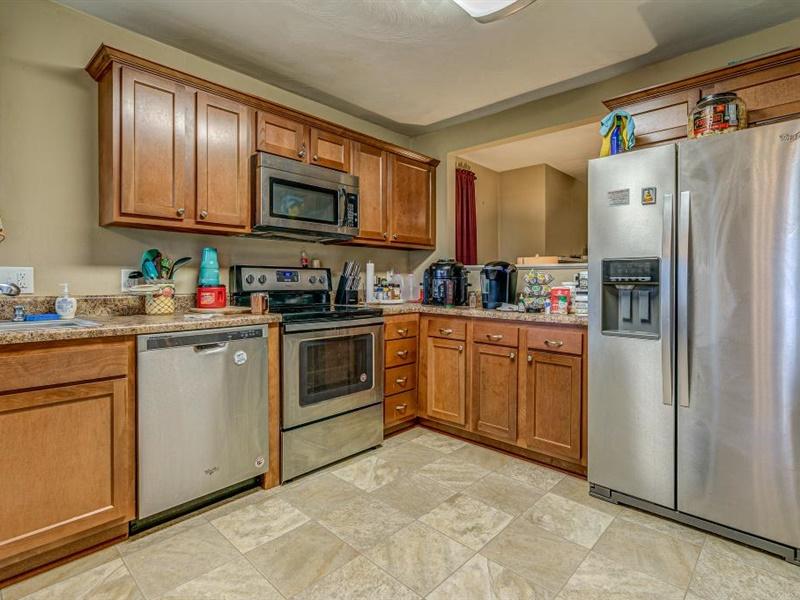 3460 Sterling Road Roanoke, VA 24014 - Photo 10 of 37 a kitchen with stainless steel appliances a refrigerator sink and cabinets