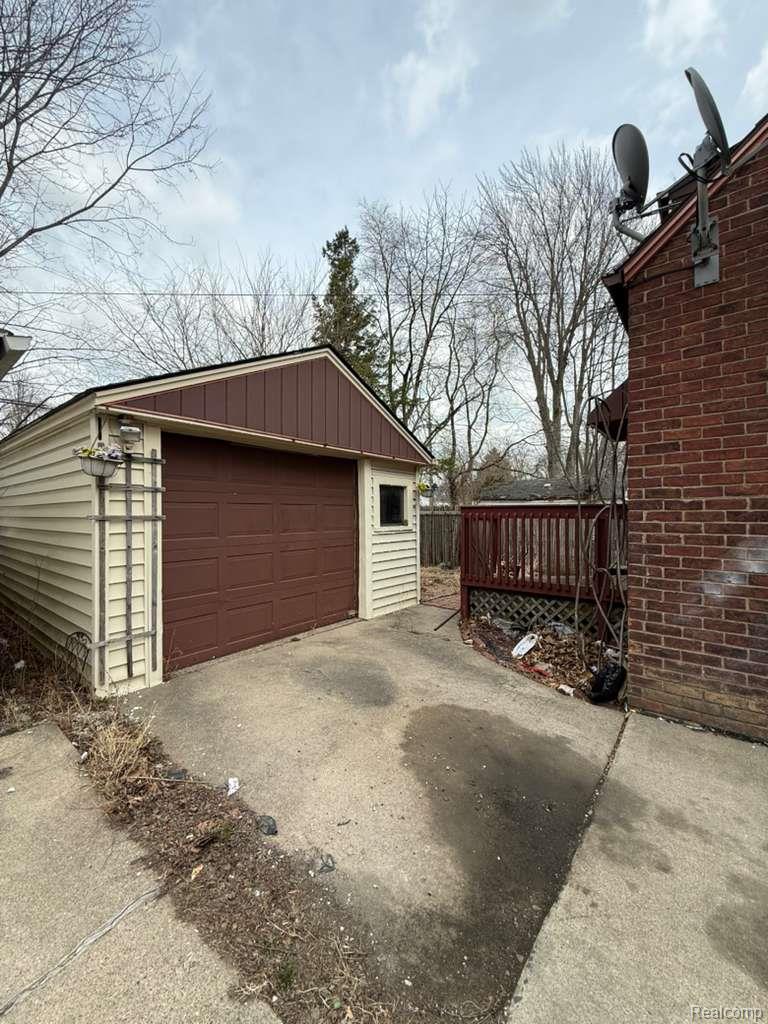 20231 Moross Road Detroit, MI 48224 - Photo 22 of 23 Detached garage with driveway