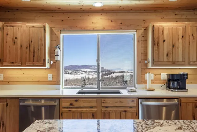 a kitchen with a sink and a window