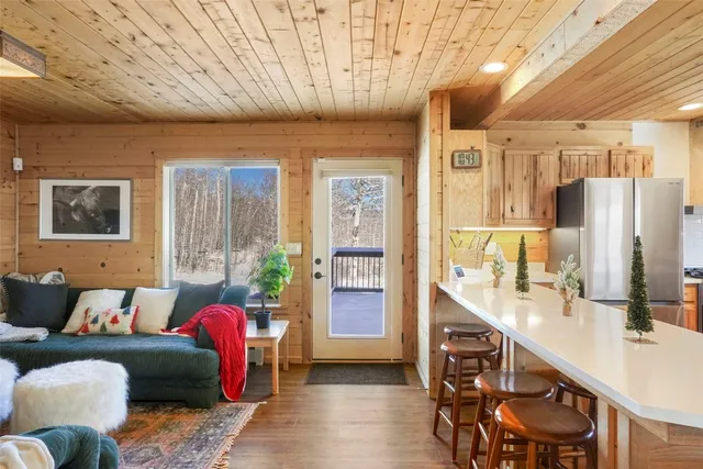 a living room with furniture and large window