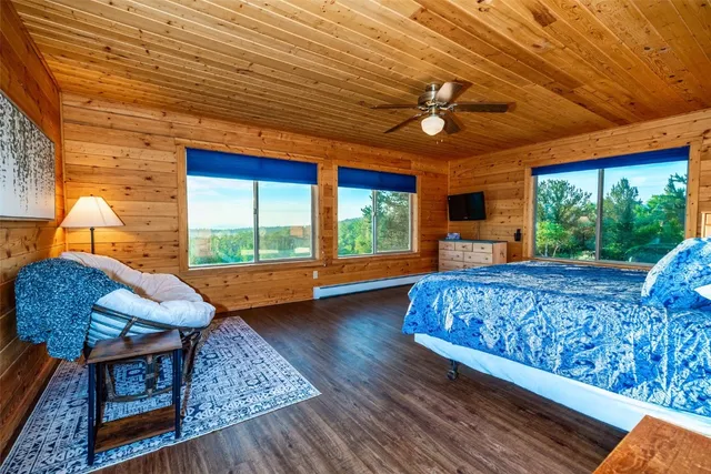 a bedroom with a bed and a balcony