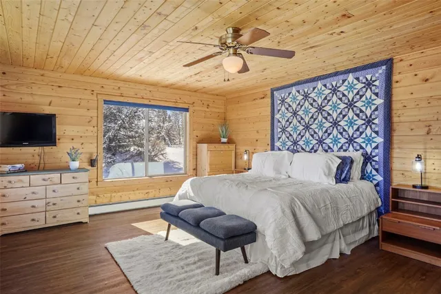 a bedroom with a bed and furniture