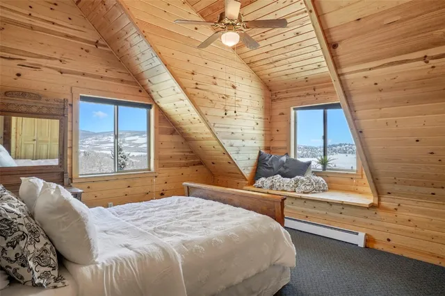 a bedroom with bed and window