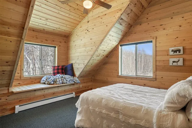 a living room with furniture and a book shelf